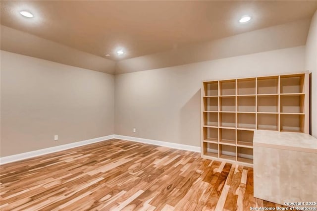 unfurnished room with hardwood / wood-style flooring