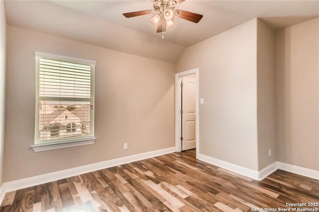 unfurnished room with ceiling fan, hardwood / wood-style floors, and lofted ceiling