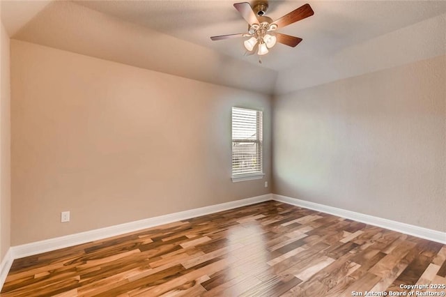 empty room with hardwood / wood-style flooring and ceiling fan