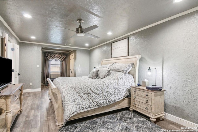 bedroom with ceiling fan, dark hardwood / wood-style flooring, and ornamental molding