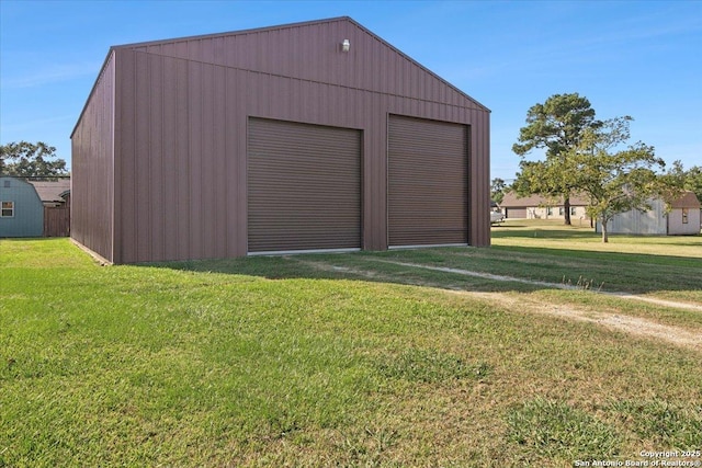 garage featuring a lawn