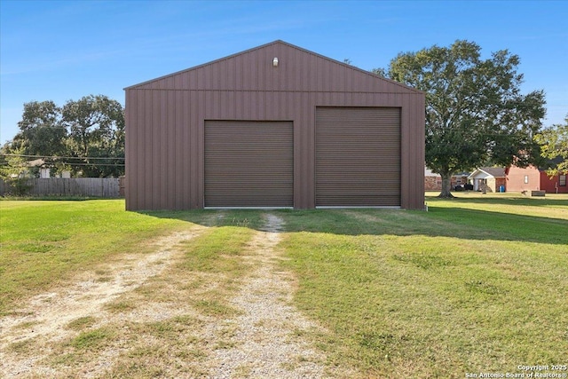 garage featuring a lawn