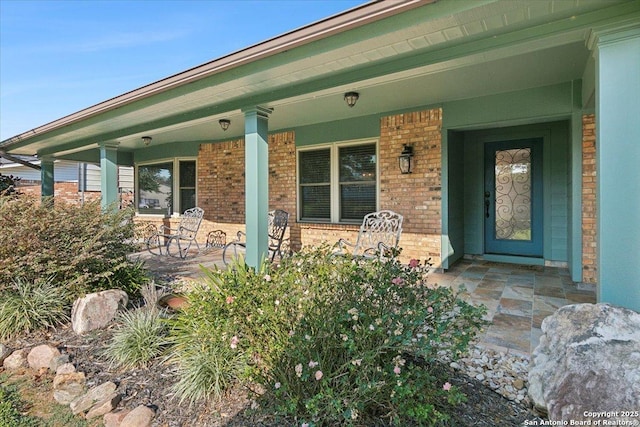 doorway to property featuring covered porch