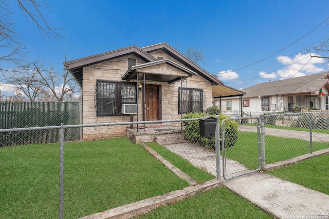 bungalow-style home with cooling unit and a front lawn