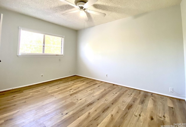 unfurnished room featuring light hardwood / wood-style floors, a textured ceiling, and ceiling fan