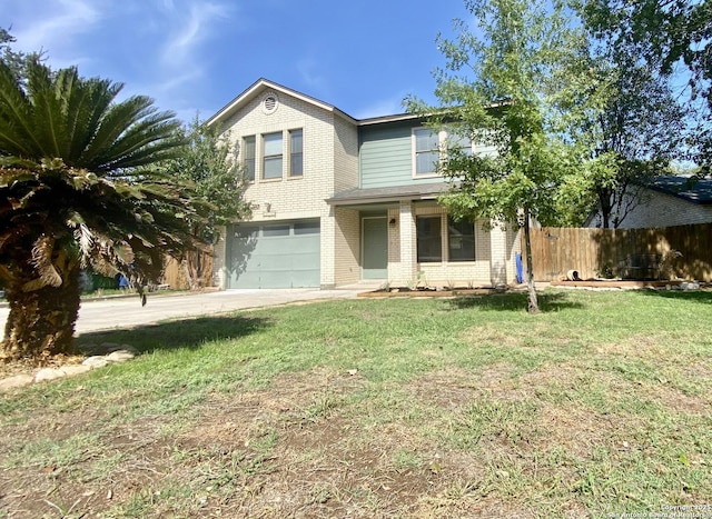 view of front of home featuring a garage and a front lawn