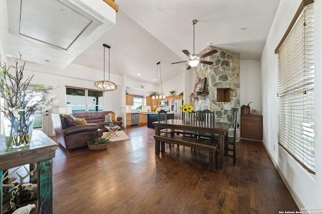 dining space with ceiling fan, dark hardwood / wood-style floors, and vaulted ceiling