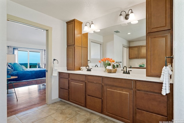 bathroom featuring tile patterned flooring and vanity