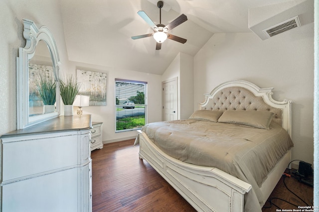 bedroom with ceiling fan, dark hardwood / wood-style floors, a closet, and vaulted ceiling