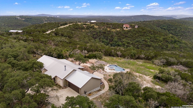 birds eye view of property with a mountain view