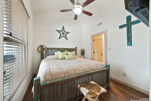 bedroom featuring lofted ceiling, ceiling fan, and dark hardwood / wood-style flooring