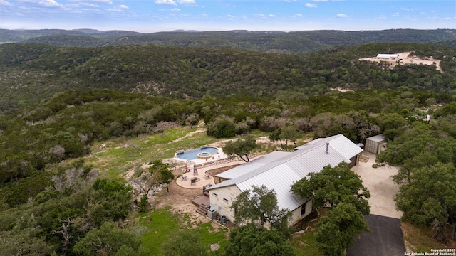 birds eye view of property featuring a mountain view