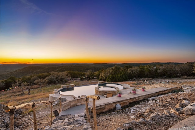 view of patio terrace at dusk