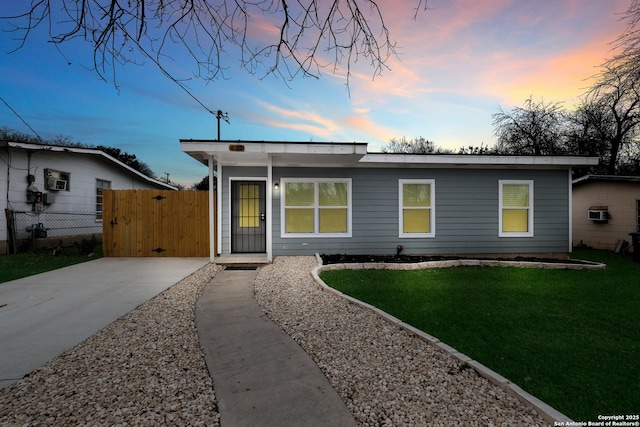 ranch-style house with a yard