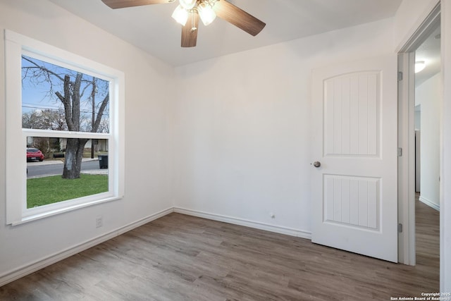 spare room featuring ceiling fan and hardwood / wood-style floors