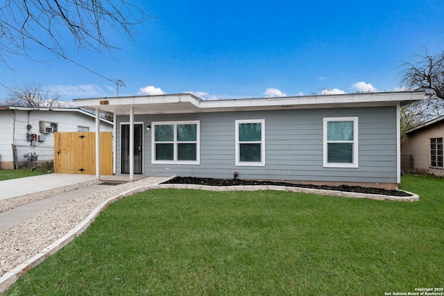 ranch-style house with a front yard and a carport