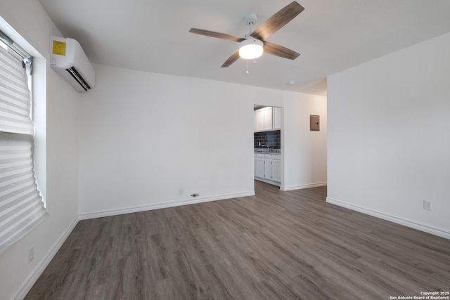 interior space with ceiling fan, a wall mounted AC, and dark hardwood / wood-style flooring