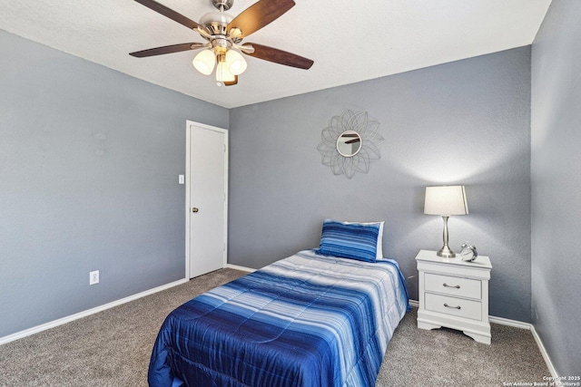 bedroom featuring ceiling fan and dark colored carpet