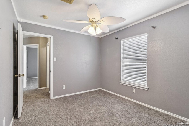 carpeted empty room featuring ceiling fan