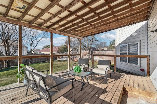 wooden terrace featuring a yard