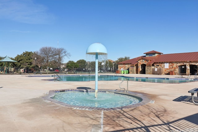 view of swimming pool with a patio