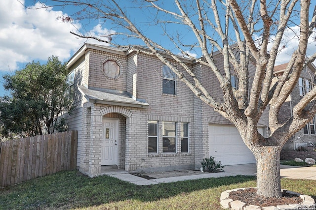 view of front of home featuring a garage and a front lawn