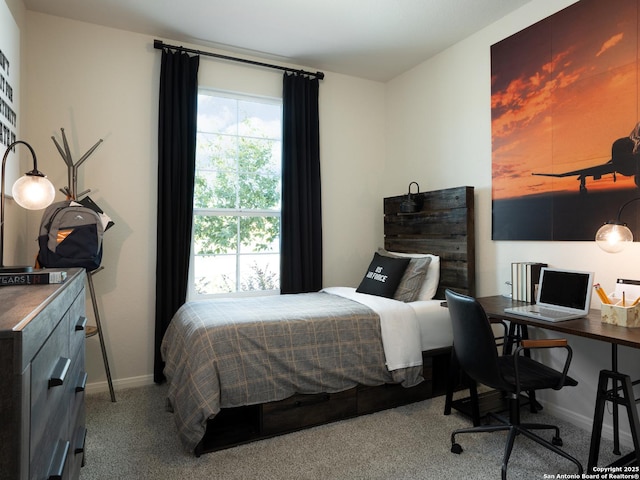 bedroom featuring light carpet