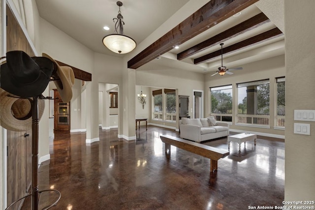 living room with beam ceiling, ceiling fan with notable chandelier, and a high ceiling