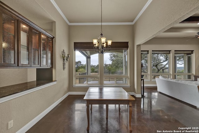 unfurnished dining area with ceiling fan with notable chandelier and ornamental molding