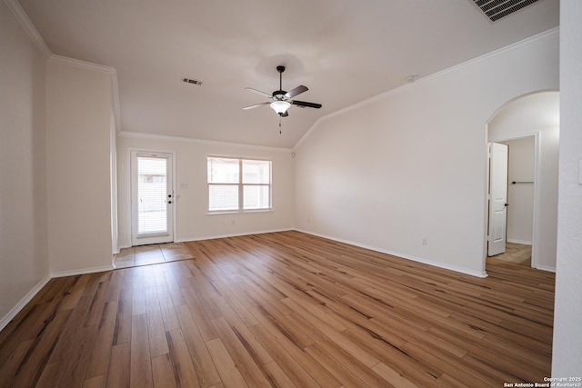 unfurnished room featuring ceiling fan, hardwood / wood-style floors, crown molding, and vaulted ceiling