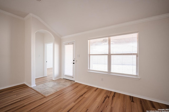 entryway with light hardwood / wood-style floors and crown molding