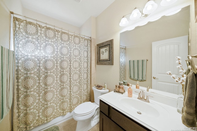 bathroom featuring vanity, toilet, and tile patterned floors