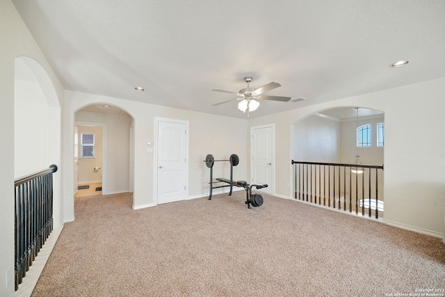 workout area featuring light colored carpet