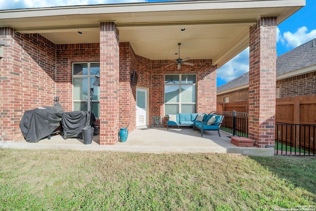 view of patio featuring ceiling fan, area for grilling, and an outdoor hangout area