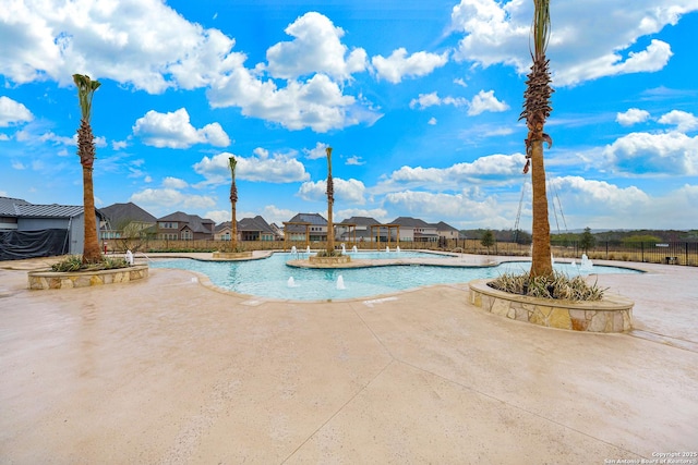 view of pool featuring a patio and pool water feature