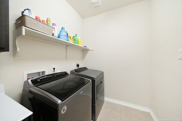 clothes washing area with independent washer and dryer