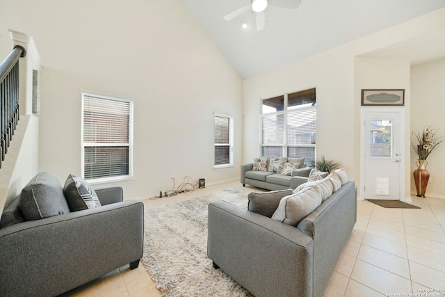 living room with light tile patterned floors, high vaulted ceiling, and ceiling fan