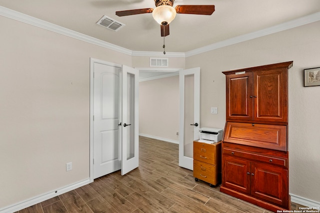 unfurnished bedroom with crown molding and ceiling fan