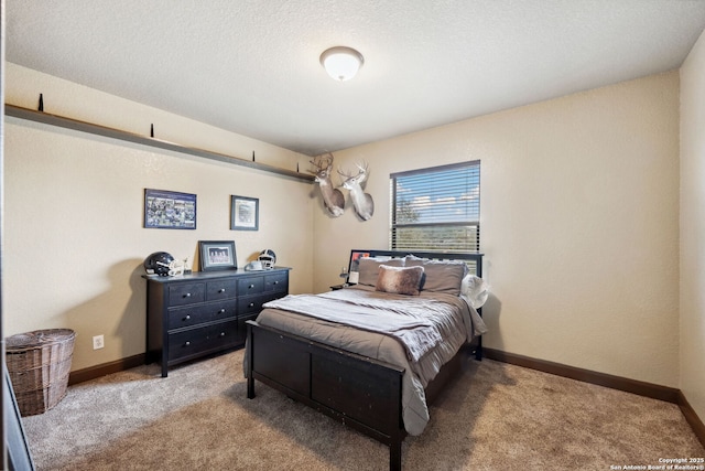 carpeted bedroom featuring a textured ceiling