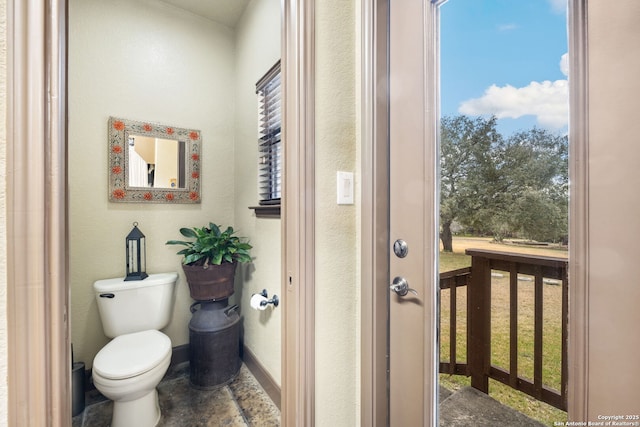 bathroom featuring toilet