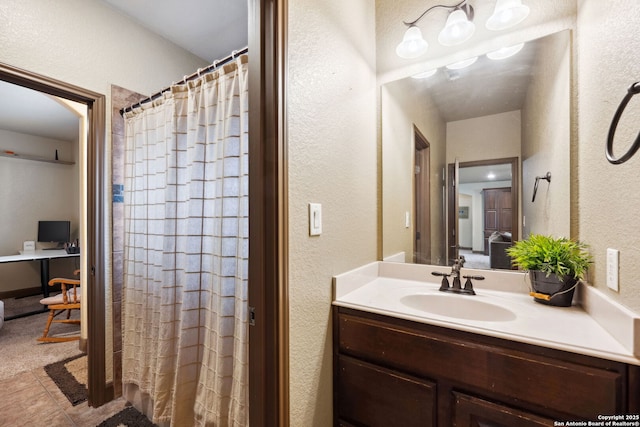 bathroom featuring vanity and walk in shower