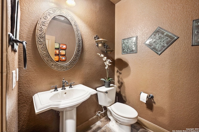 bathroom featuring toilet