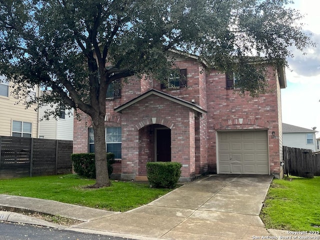 view of front facade with a garage and a front yard