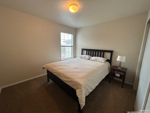 bedroom featuring dark colored carpet