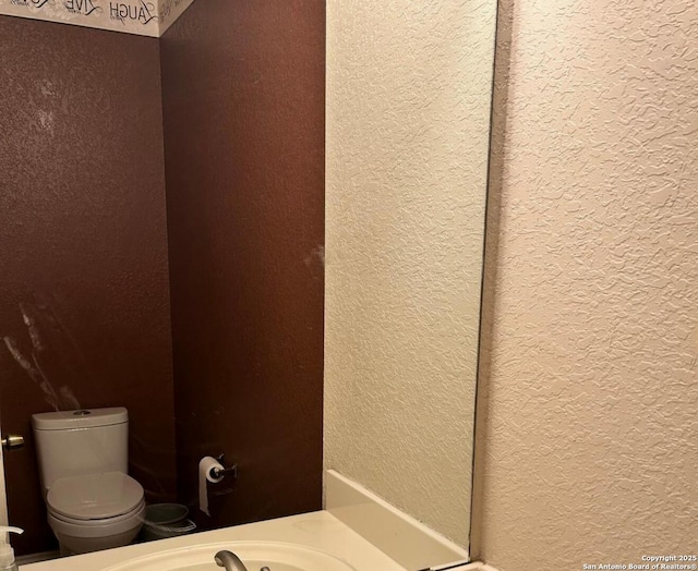 bathroom featuring toilet