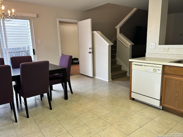 dining room with light tile patterned flooring and a notable chandelier