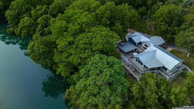 birds eye view of property with a water view