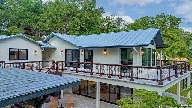 back of house with a patio