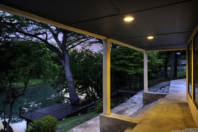 view of patio terrace at dusk