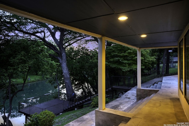 view of patio terrace at dusk